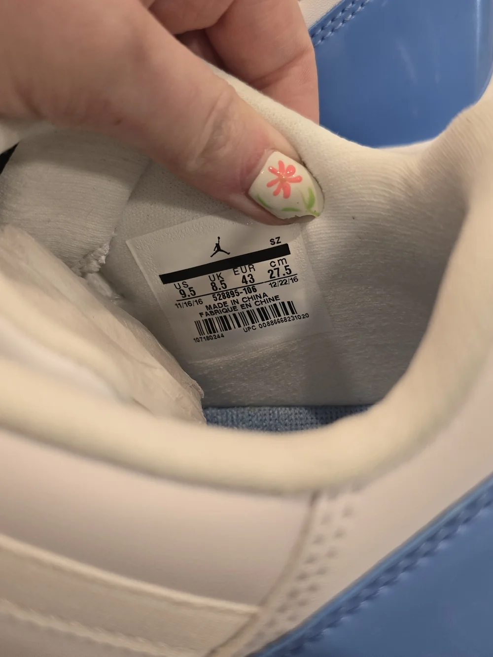 Air Jordan 11 Low Retro White and University Blue Sneakers